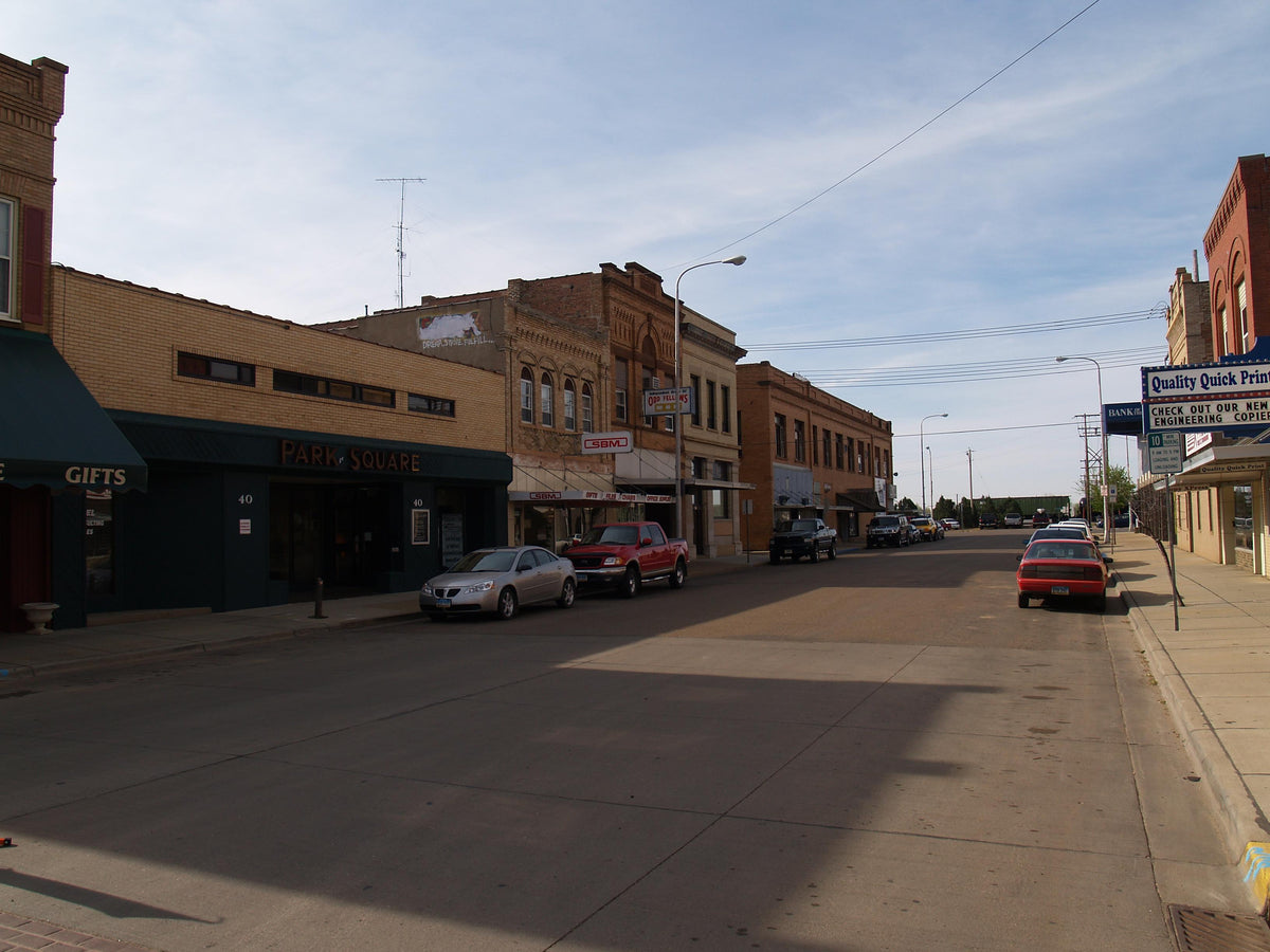 Downtown Dickinson, North Dakota streetscape featuring Chambré Boutique and nearby businesses