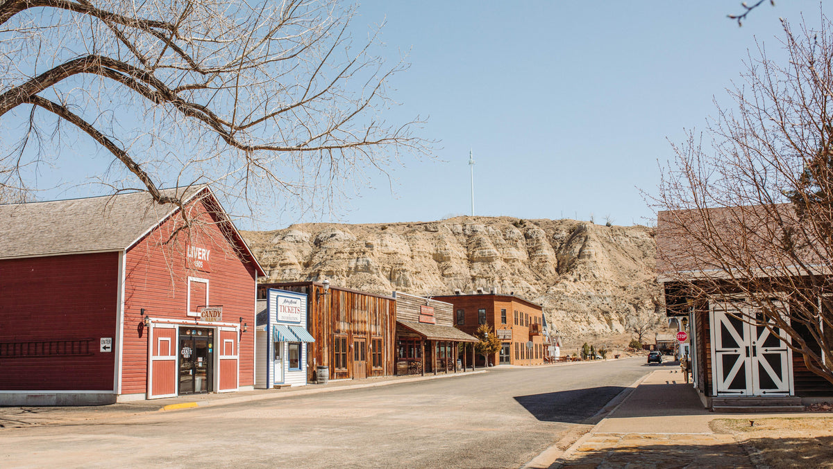Historic Main Street in Medora, North Dakota with the Badlands in the background